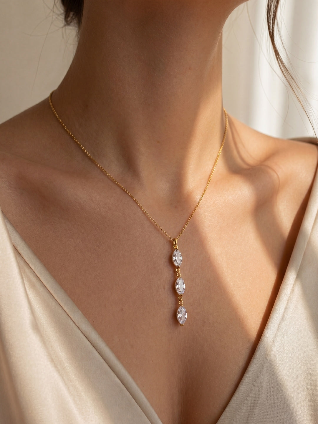 Golden Y-Long Necklace worn with a soft satin outfit